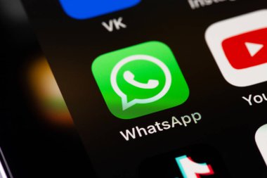 WhatsApp mobile icon app on screen smartphone iPhone interface. WhatsApp is a popular free instant text messaging system for mobile and other platforms. Moscow, Russia - August 11, 2021