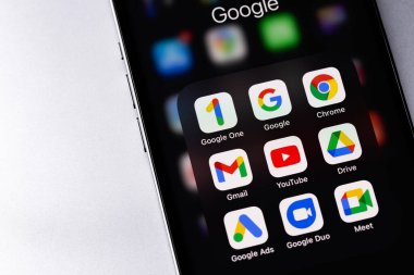 Google services (Google One, Google, Gmail, Chrome, Ads) icons apps on screen smartphone iPhone closeup. Google is the biggest Internet search engine in the world. Batumi, Georgia - March 4, 2022