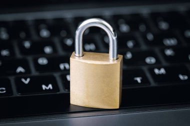 metal lock and keyboard notebook