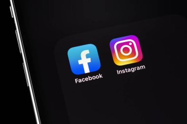 showing social media apps Facebook, Instagram -  on screen smartphone iPhone closeup. Batumi, Georgia - March 2, 2022