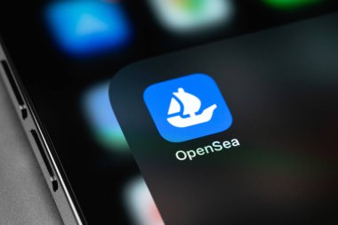 OpenSea mobile icon app on the screen smartphone iPhone closeup. OpenSea is a marketplace for non-fungible tokens. Batumi, Georgia - March 15, 2022