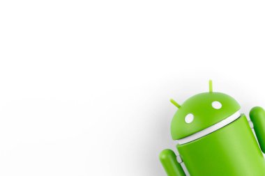 Google Android figure on the right side on white background . Google Android is the operating system for smartphones, tablet computers, e-books and other devices. Batumi, Georgia - May 13, 2022