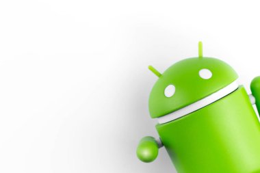 Google Android figure on the right side on white background closeup. Google Android is the operating system for smartphones, tablet computers, e-books and other devices. Batumi, Georgia - May 13, 2022