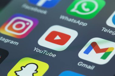 showing social media mobile apps icons (Instagram, Facenook, WhatsApp, Youtube, Gmail, Telegram, Snapchat) on the screen smartphone, interface iPhone macro. Batumi, Georgia - May 4, 2022