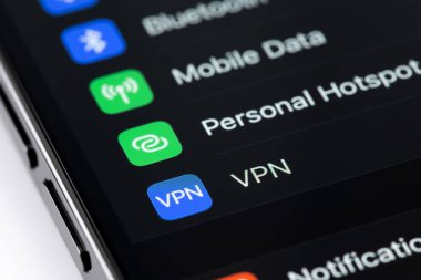 VPN (Virtual Private Network) icon on screen smartphone, iPhone inteface settings macro. Apple Inc. is an American multinational technology company. Batumi, Georgia - May 4, 2022