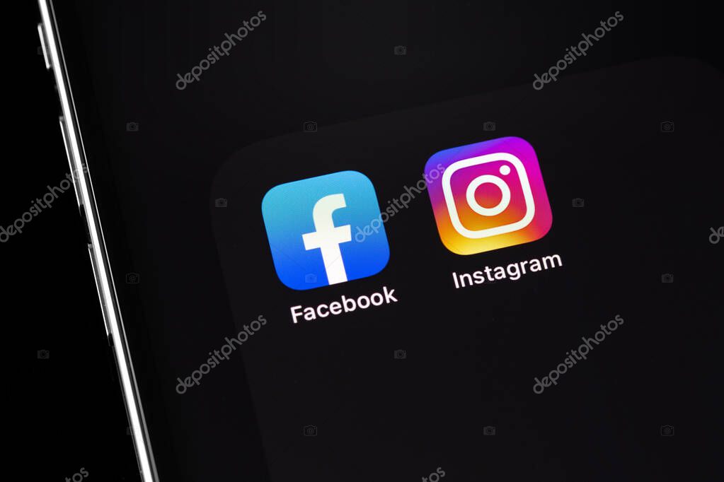 Showing social media apps Facebook, Instagram -  on screen smartphone iPhone closeup. Batumi, Georgia - March 2, 2022