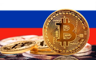 bitcoin coin with russian flag in the background, several bitcoin coins with russian flag in the background, bitcoin and russia concept