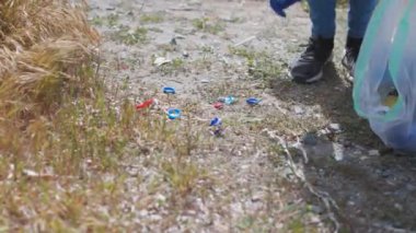 volunteers collecting rubbish garbage on the beach 4k clean up green plastic polution 