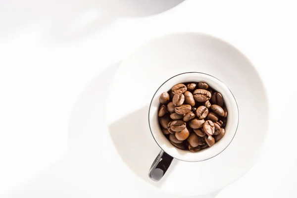 Black white espresso cup with coffee beans on saucers on a white background. Lifestyle. Your own space. Flatley. — Stockfoto