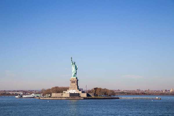 New York City, United States - November 18, 2016: The Statue of Liberty as seen from the Staten Island ferry boat