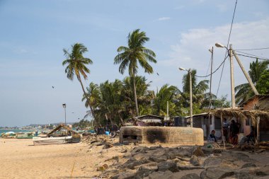 Trincomalee, Sri Lanka - August 24, 2018: Old concrete bunker at the sand beach