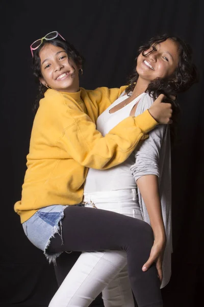 Two Smiling Latin Girls Portrait Black Background — Stock Photo, Image