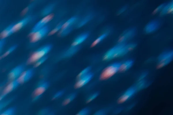 Bokeh light lens flare overlay blue flecks dark — Stock Photo, Image