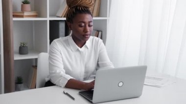 office worker african woman online communication