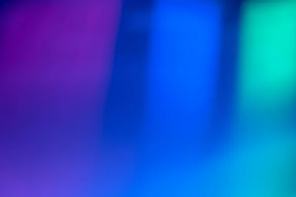 Oskärpa neon strålar färg ljus överlagring blå rosa grön — Stockfoto