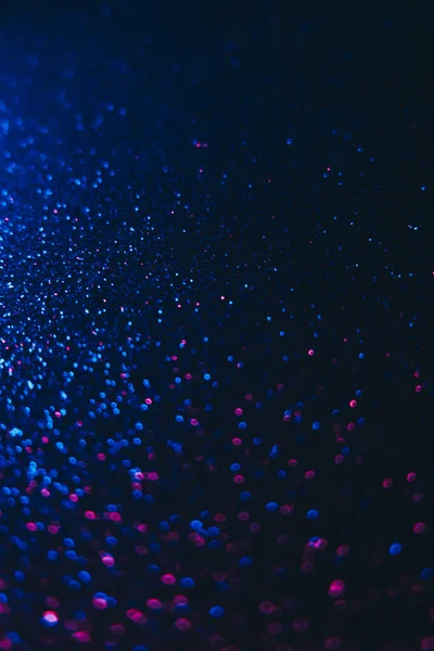 Bokeh vonken neon glitter achtergrond blauw donker — Stockfoto