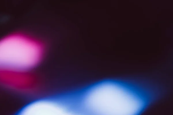 Flou éclat superposition néon flash lumière rose bleu noir — Photo