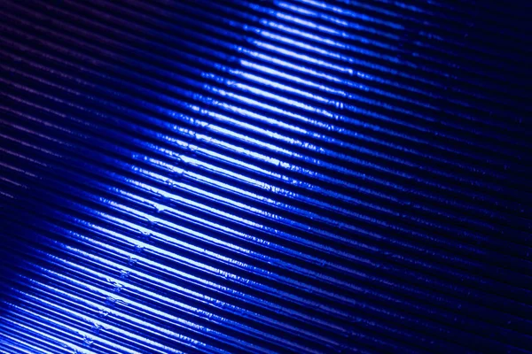 Гофрована текстура неонове світле тло блакитне сяйво — стокове фото