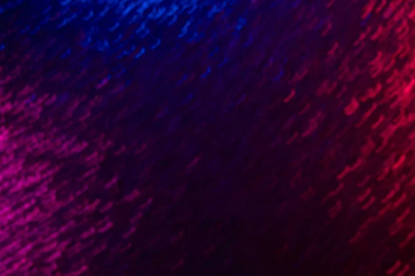 Люмінесцентне розмивання фону неонові іскри фіолетовий червоний — стокове фото