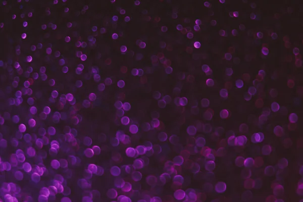 Bokeh světlo pozadí rozostření neonové kruhy fialová — Stock fotografie