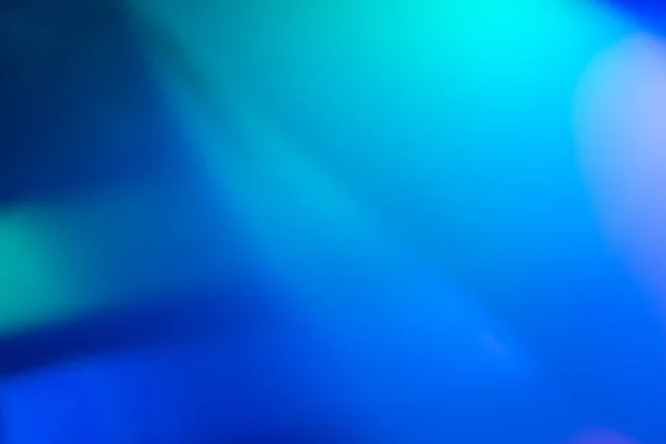 Oskärpa neon strålar färg ljus överlagring blå grön glöd — Stockfoto