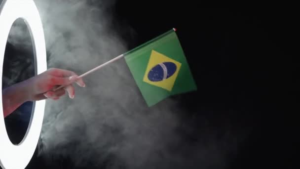 Brazil flag patriotic identity fan hand on black — Stock Video