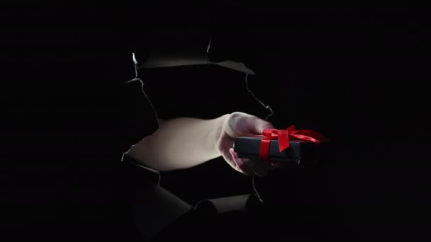 Black friday night sale hand gift box breakthrough — Stock Video