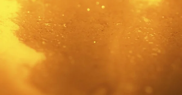 Wazige glitter textuur gouden achtergrond schittert — Stockfoto