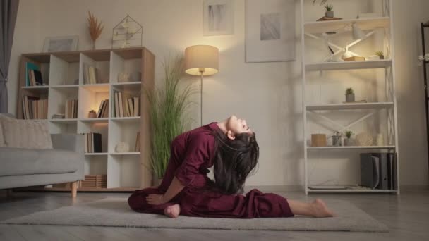 Yoga stretching flexibility exercise woman home — стоковое видео