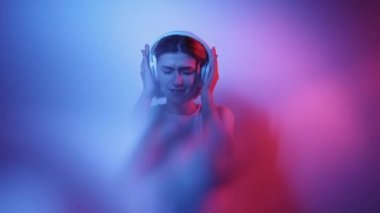 music energy neon light girl dancing in headphones
