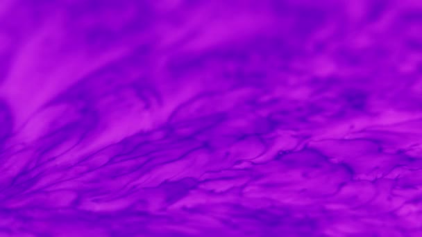 Fluorescent clouds ink water flow purple blue mist — Video