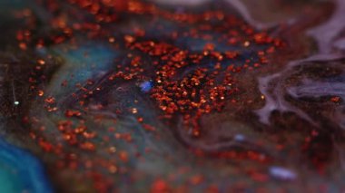 parlak sıvı karışım mürekkep arkaplan kırmızı pullar