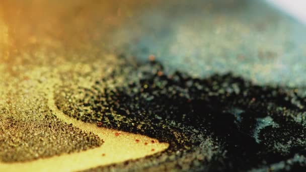 Sparkling fluid texture bokeh light gold black ink — Stok video