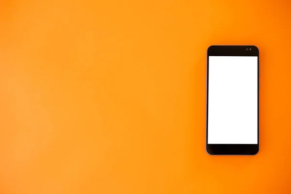 Online information. Digital mockup. Mobile connection. Smartphone with white blank screen isolated orange background copy space.