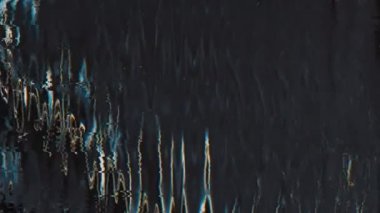 Analog TV glitch. Noise overlay. VHS distortion texture. Blue orange black color flicker fuzzy vibration static artifacts dust scratches on dark abstract background.