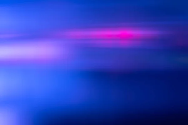 Defocused light overlay. Blur neon glow. Sci-Fi LED glare. Blur navy blue magenta pink color flare flecks motion futuristic abstract copy space background.