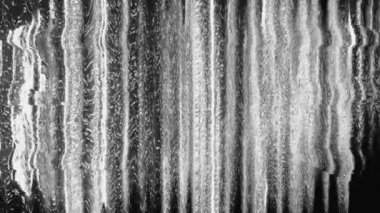 Static distortion texture. VHS glitch. Transmission defect. Black white fuzzy stripes vibration analog noise retro abstract background.
