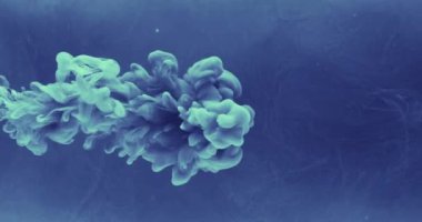 Ink water drop. Fluid splash. Logo reveal effect. Blue color paint flow dissolving motion on dark mist cloud abstract background shot on RED Cinema camera.