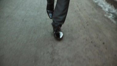 Business man way. Street walk. Professional journey. Career goal. Unrecognizable male pedestrian legs confident steps forward on winter asphalt road.