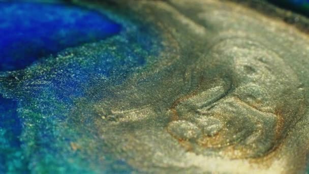 Shimmering Fluid Glitter Ink Wave Sand Seashore Defocused Gold Blue — Stockvideo