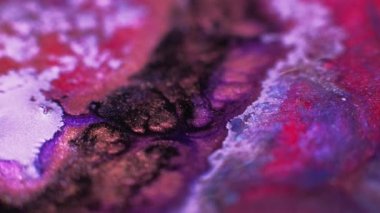Color ink splash. Glitter fluid texture. Paint mix flow. Defocused neon pink purple black gold bubble wet dye abstract art background.