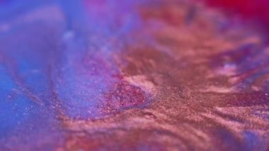 Glitter splatter. Color bokeh sparkles. Shiny particles flow. Blur bronze orange red blue color gradient ink motion grain texture abstract background.