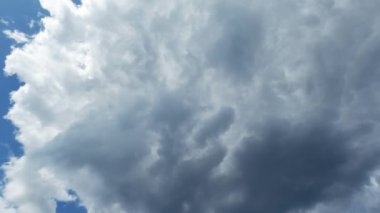 Sky magic. Aerial view. Good weather. White gray dense fluffy clouds flying in heaven slow motion.