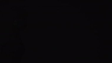 Thief crime. Criminal security. Police escape. Careful cautious mature woman sneaking in red blue emergency flashing alert lights.