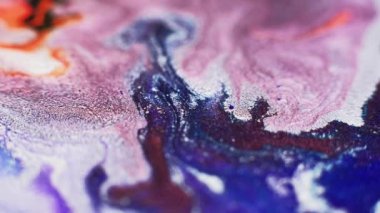 Ink floating. Sparkling color mix. Glitter paint blend. Blur pink blue orange white shimmering fluid pour motion abstract art background.