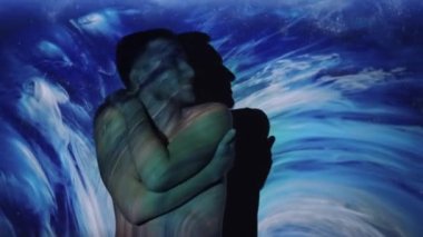 Spiritual harmony. Soul healing. Vitality recreation. Silhouette of relaxed happy satisfied shirtless man touching body skin in blue white mist cloud projector light.