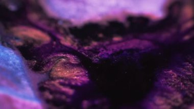 Color glitter background. Ink mix flow. Marble texture. Blur neon purple blue black golden blue shimmering bubble fluid swirl motion.
