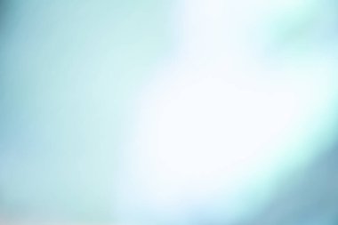 Defocused light leak. Bokeh glow overlay. Smooth illumination. Blur blue white color gradient flare texture abstract copy space background.