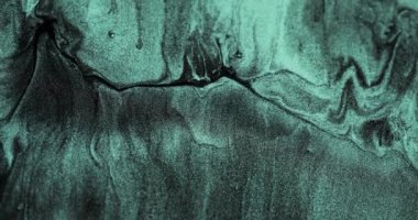 Glitter fluid flow. Sparkling particles texture. Shimmering wave. Verdigris green black color shiny marble abstract background. Shot on RED Cinema camera.