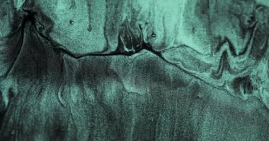 Glitter fluid flow. Sparkling particles texture. Shimmering wave. Verdigris green black color shiny marble abstract background. Shot on RED Cinema camera.